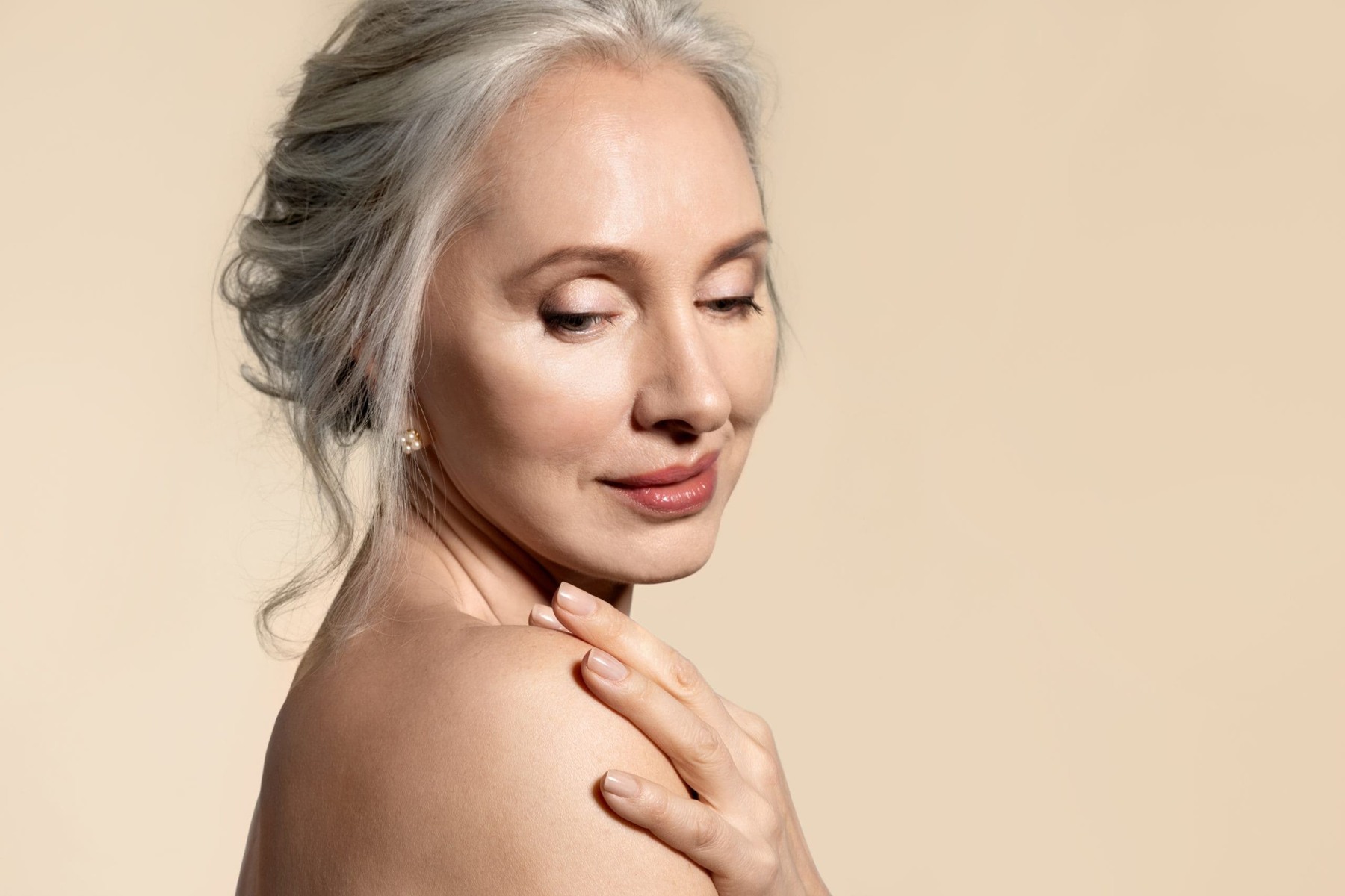 Editorial portrait of a woman with silver hair